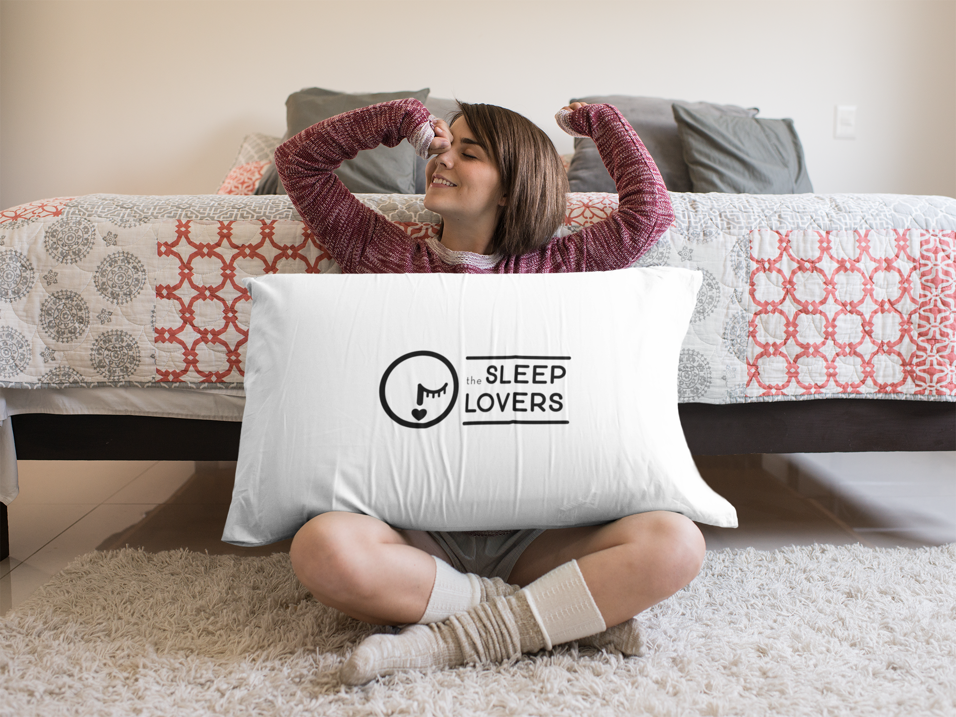 young-girl-waking-up-sitting-down-with-a-big-pillow-mockup-a14949